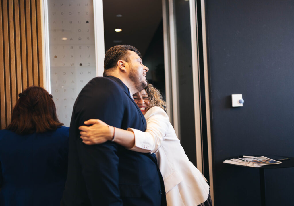 Veronica hugging a member from HLC